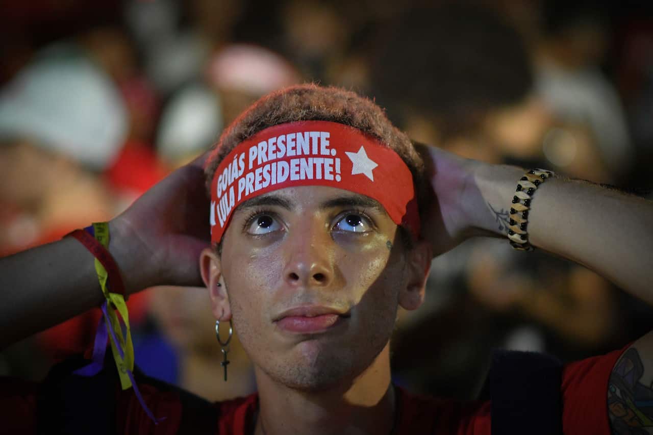 Supporters of ex-president Luiz Inacio Lula da Silva watch the coverage of the Supreme Court vote.