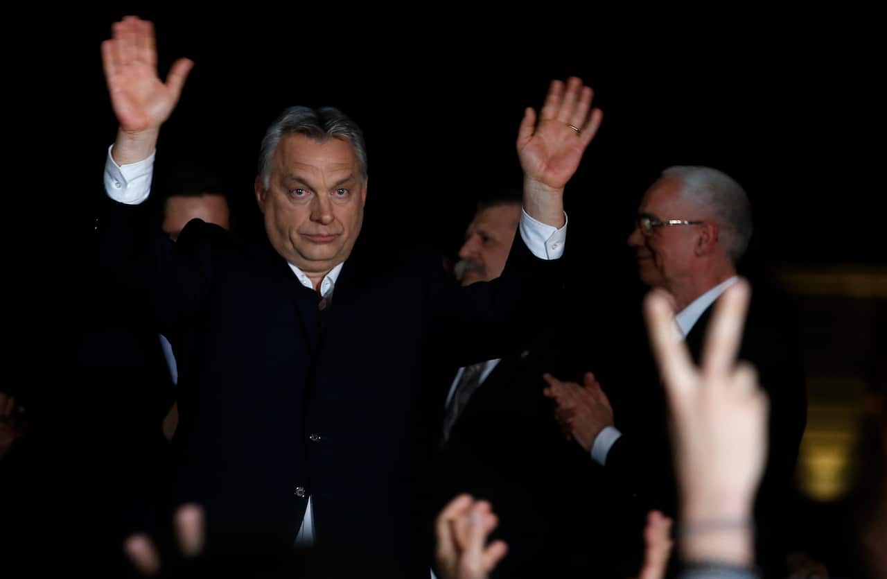 Hungarian Prime Minister Viktor Orban greets his supporters in Budapest, Hungary, Sunday, April 8, 2018.