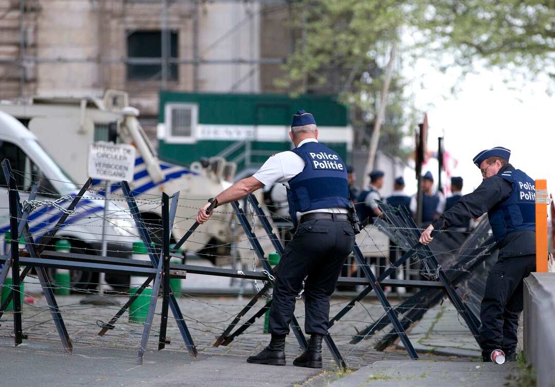 Police move a barrier outside the Brussels justice palace during the trial.