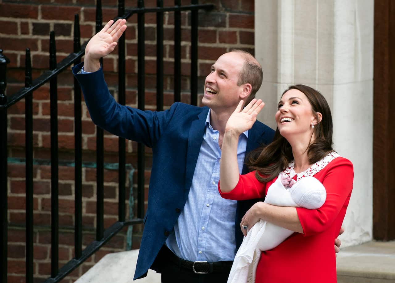 Britain's Prince William, Duke of Cambridge stands next to his wife Catherine, Duchess of Cambridge who holds their newborn son outside the Lindo Wing at St. Mary's Hospital