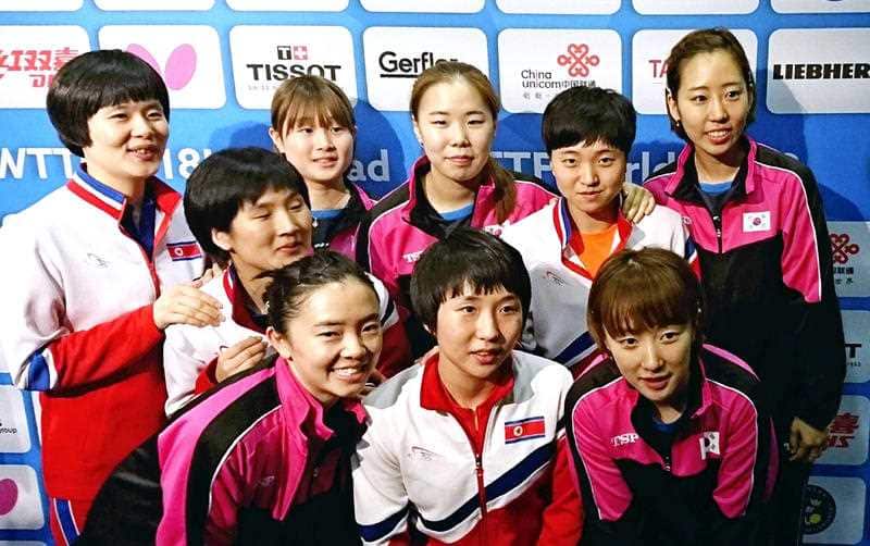 Members of North Korea and South Korea table tennis teams pose for a photograph after deciding to combine their teams to avoid playing against each other in the Quarter Finals.