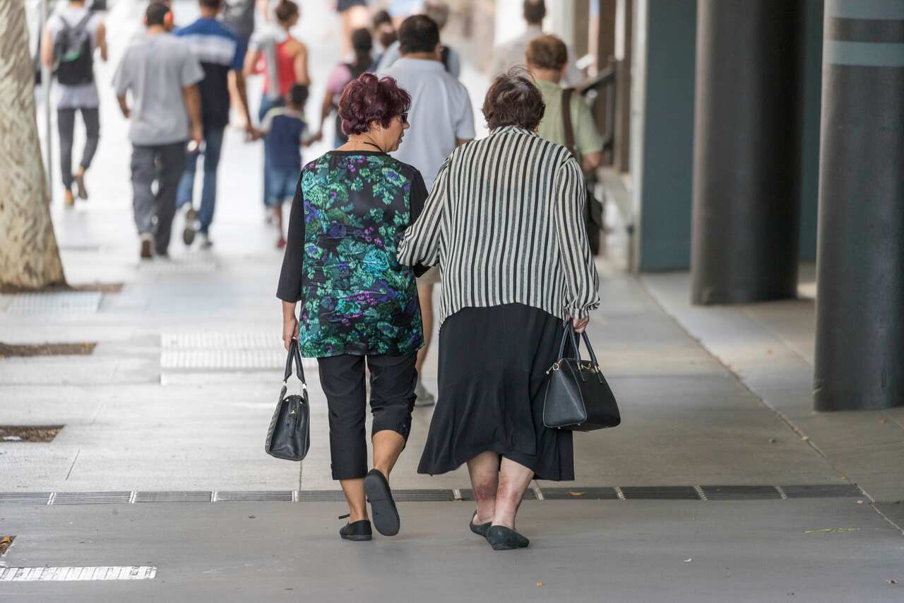 Elderly people walk in the street, in Brisbane, Saturday, May 5, 2018. (AAP Image/Glenn Hunt) NO ARCHIVING
