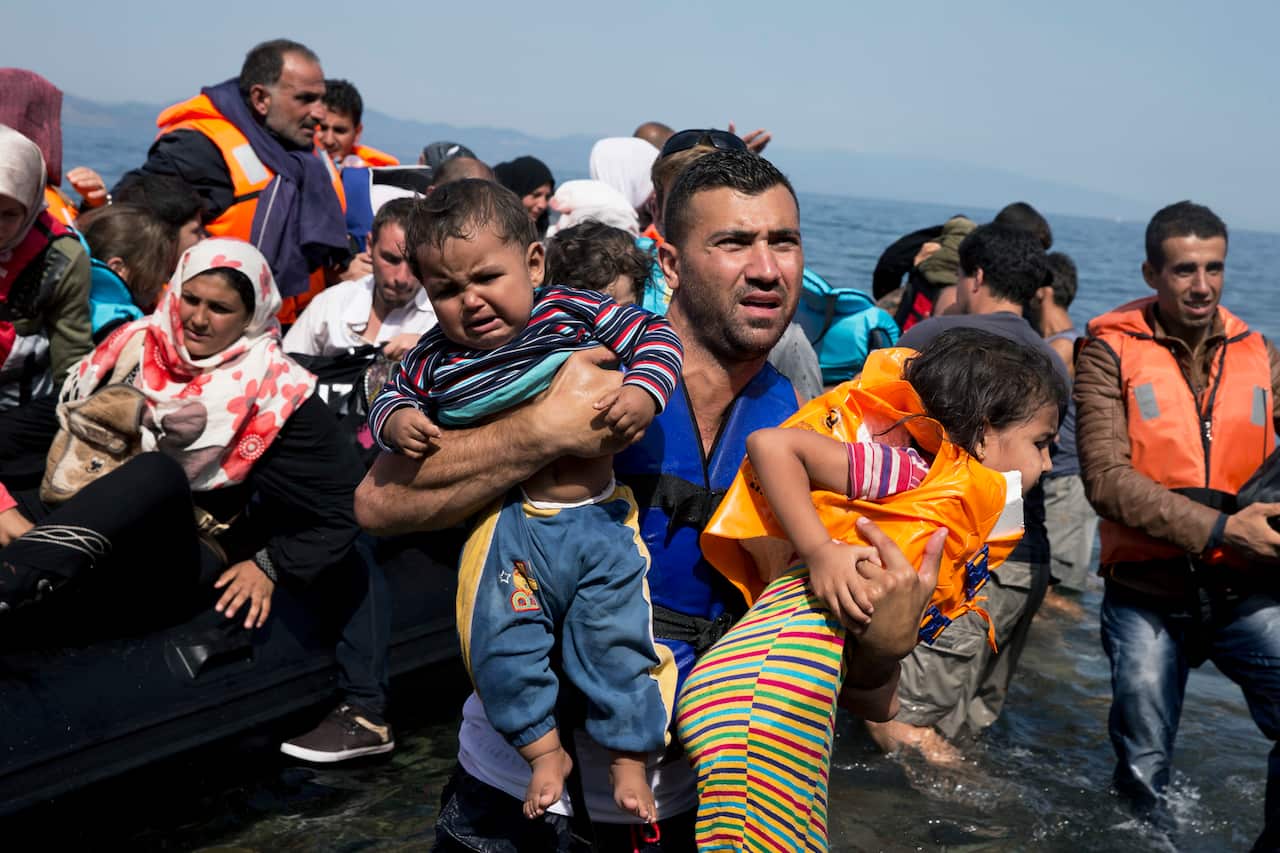 Refugees arrive on Lesbos after crossing from Turkey.