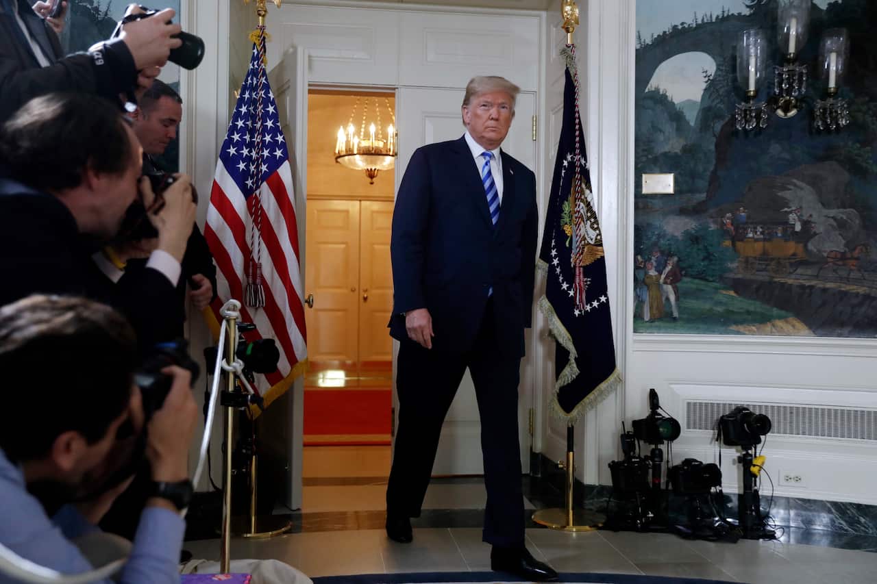 President Donald Trump arrives to deliver a statement on the Iran nuclear deal from the Diplomatic Reception Room of the White House, Tuesday, May 8, 2018, in Washington. (AP Photo/Evan Vucci)