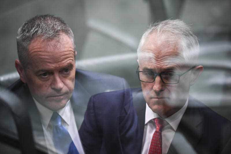 A double exposure of Australian Opposition Leader Bill Shorten (left) and Australian Prime Minister Malcolm Turnbull during House of Representatives Question Time at Parliament House in Canberra, Wednesday, May 9, 2018.