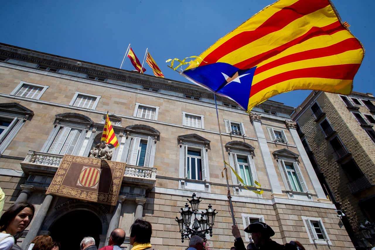 The unofficial Catalan flag 'Estelada' flies at Sant Jaume square during the investiture of the new Cataln regional President, Quim Torra.