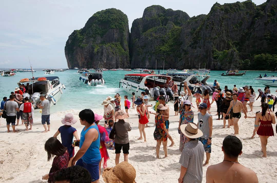 Tourists visit Maya Bay, the beach made famous by Danny Boyle’s film The Beach.