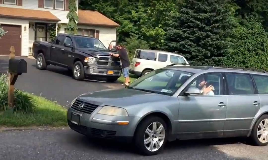 Thirty-year-old Michael Rotondo waves to the media as he leaves his parents' house in Camillus, N.Y., around 9:30 a.m. Friday, June 1, 2018.