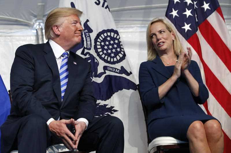 Homeland Security Secretary Kirstjen Nielsen applauds President Donald Trump