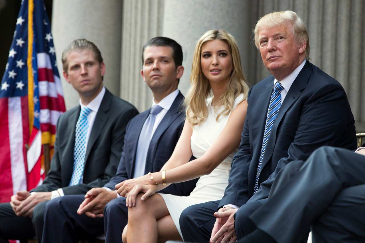 A 2014 file photo of Donald Trump with his children, from left, Eric Trump, Donald Trump Jr., and Ivanka Trump.