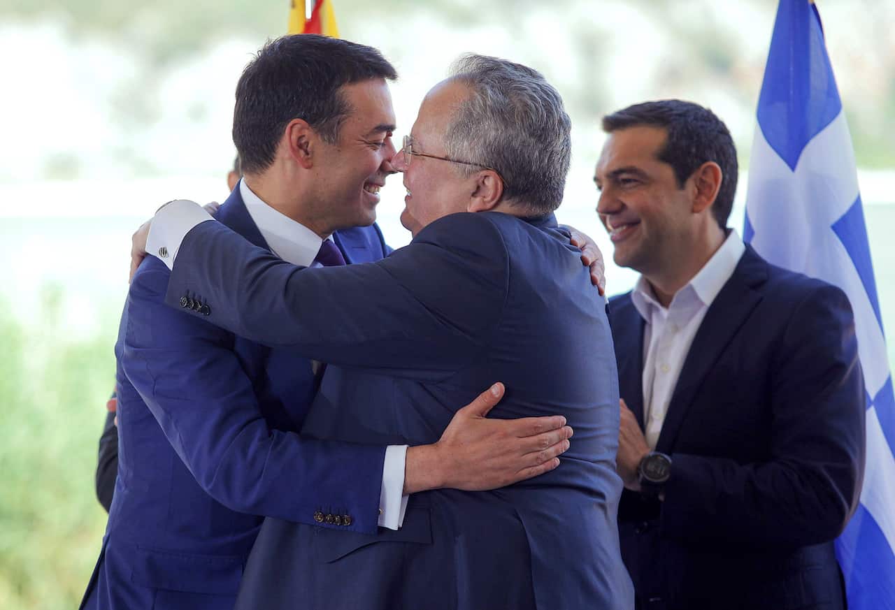 Foreign ministers of Greece, Nikos Kotzias (C) and Former Yugoslav Republic of Macedonia Nikola Dimitrov (L) and Greek Prime Minister Alexis Tsipras