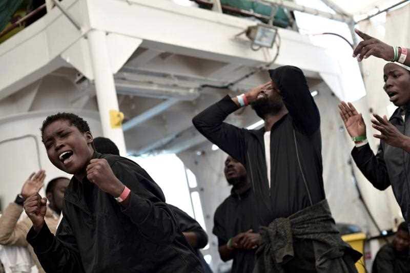 Migrants rejoicing in their last moments on board the 'Aquarius' rescue vessel before disembarking in Valencia, Spain, 17 June.