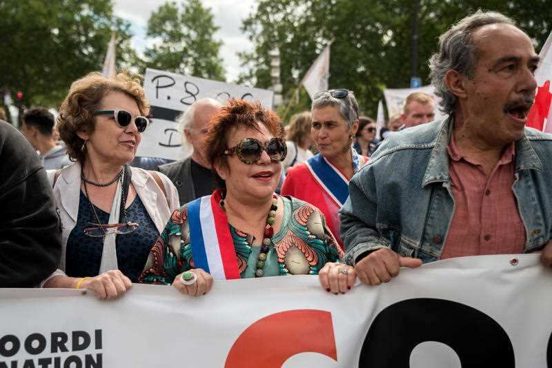 Protesters in Paris march in support of migrants.