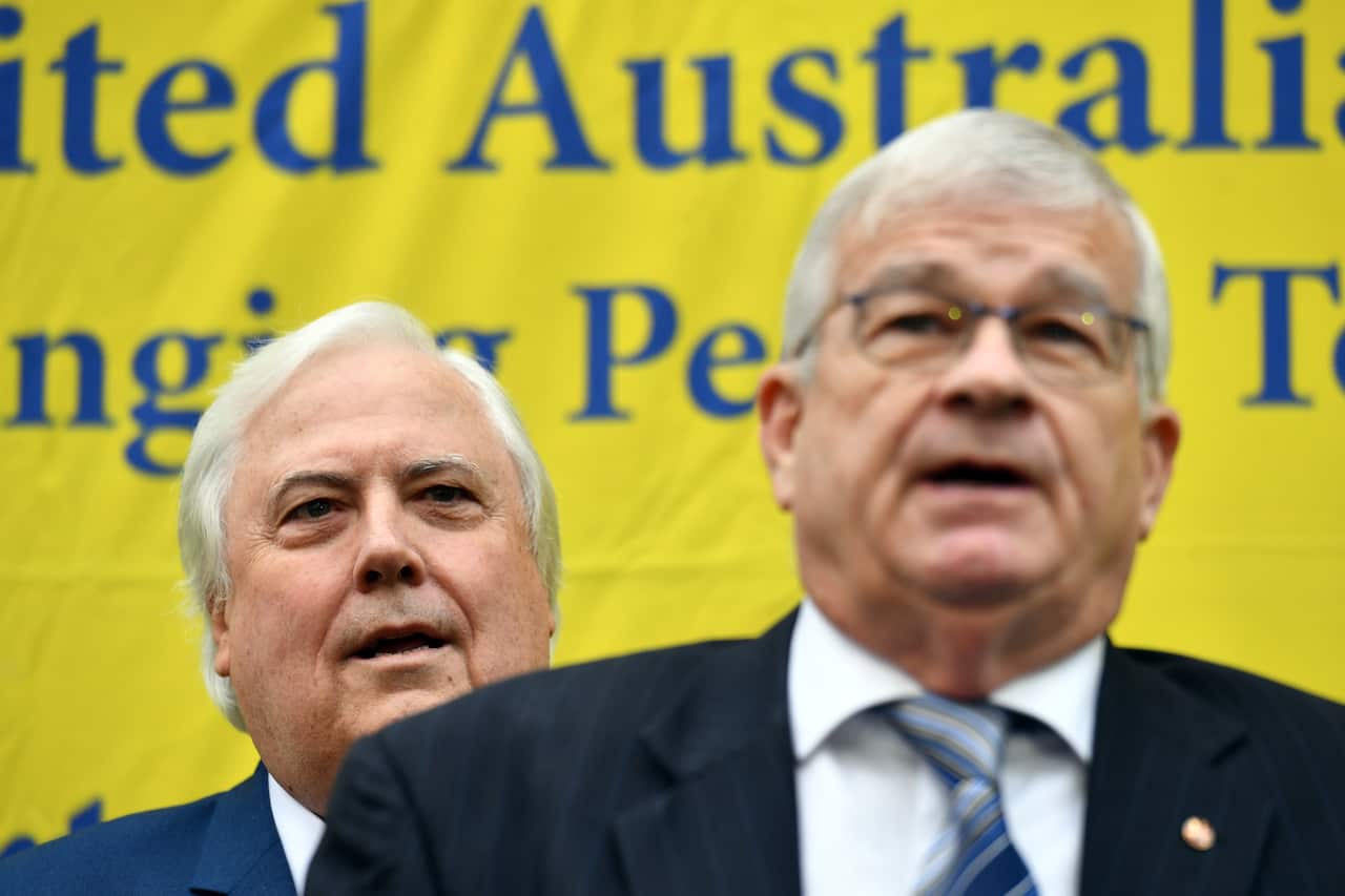 Former One Nation Senator Brian Burston and businessman Clive Palmer at a press conference to announce the formation of the United Australia Party at Parliament House in Canberra, Monday, June 18, 2018. (AAP Image/Mick Tsikas) NO ARCHIVING