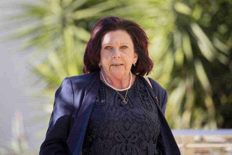 Kim Dorsett(mother of siblings Kate Goodchild and Luke Dorsett) enters the coroner's inquest, into the deaths of four people at Dreamworld.