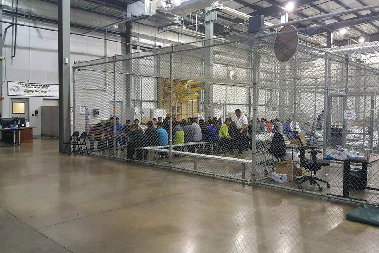 People inside a United States Border Patrol Processing Center in McAllen, Texas, USA. 