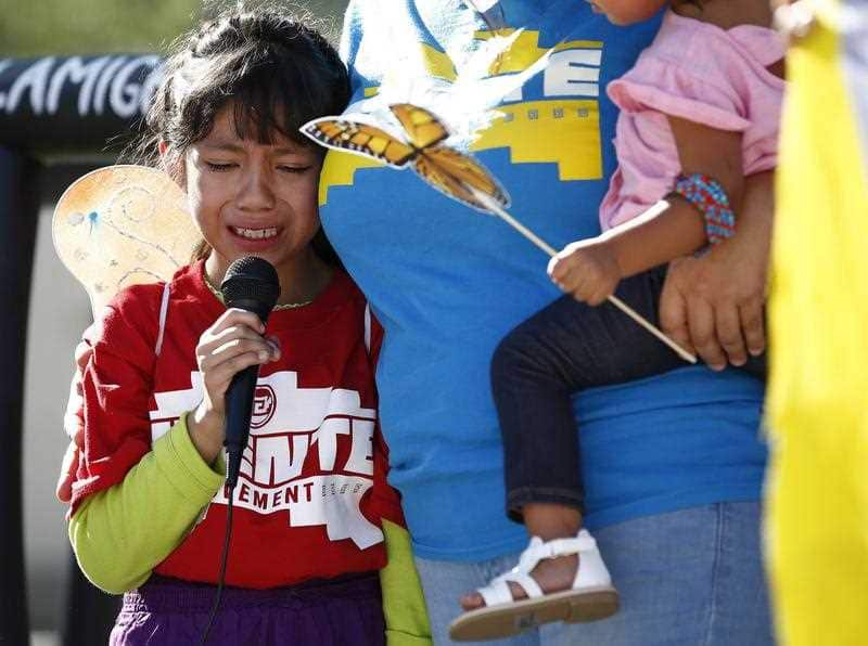 Akemi Vargas, 8, cries as she talks about being separated from her father during an immigration family separation protest.