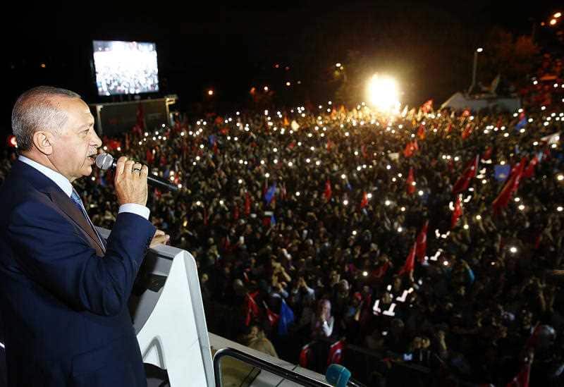 Turkey's President and leader of ruling Justice and Development Party Recep Tayyip Erdogan addresses his supporters from his Tarabya Palace in Istanbul, late Sunday, June 24, 2018.