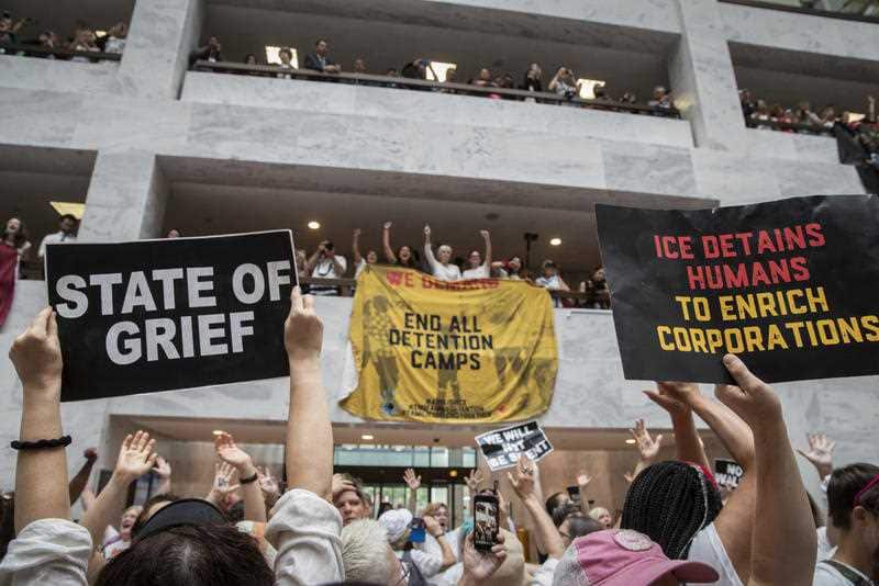 Hundreds of activists protest the Trump administration's approach to illegal border crossings and separation of children from immigrant parents, in the Hart Senate Office Building on Capitol Hill in Washington, Thursday, June 28, 2018.