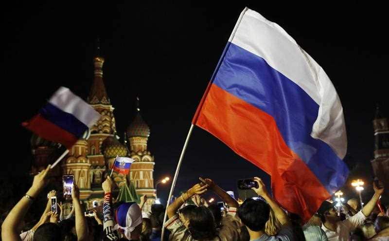 Supporters of Russia celebrate on the Red Square after their team's victory in the FIFA World Cup 2018 round of 16.