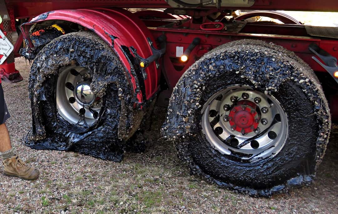 A Lindsay Transport truck with damaged tires.
