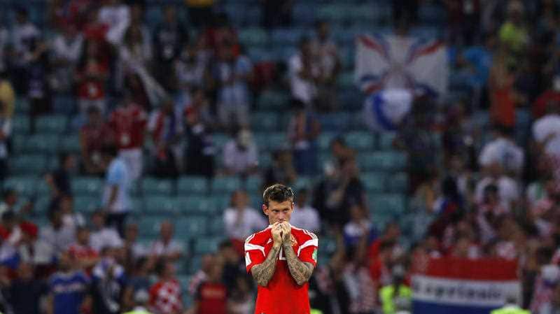 Russia's Fyodor Smolov leaves the pitch after losing the quarterfinal match between Russia and Croatia.