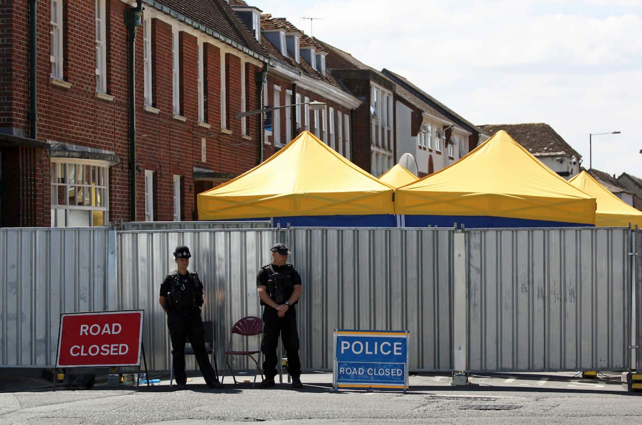Officers on duty in Rollestone Street, Salisbury, Wiltshire as police investigate the death of Dawn Sturgess.
