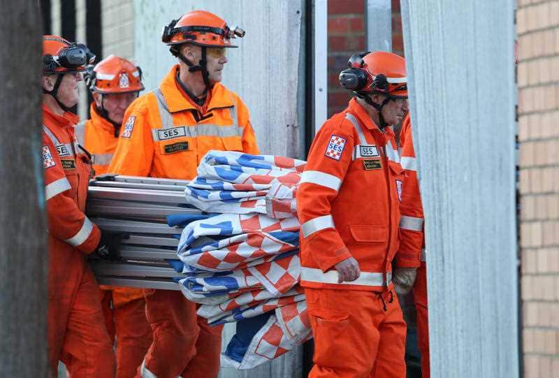 SES workers are seen at the scene where human remains were found at a storage facility in Oakleigh South, Melbourne