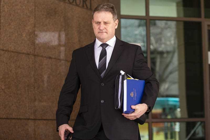Missing Person Detective Graham Hamilton leaves the Melbourne Magistrates Court after giving evidence in the Ristevski case in Melbourne, Wednesday, July 25, 2018.