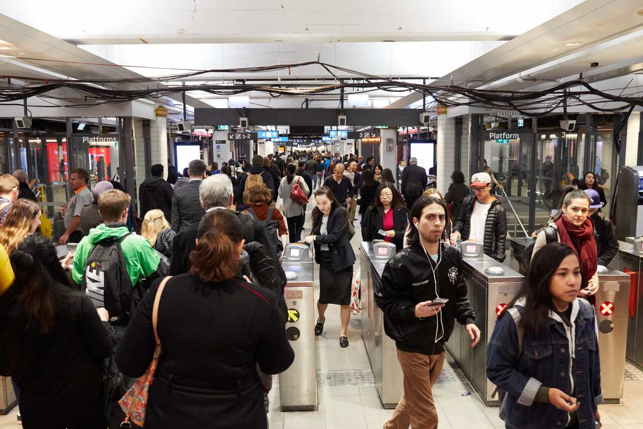 Commuters are seen in Town Hall station during peak hour in Sydney, Tuesday, August 7, 2018. Australia's population is expected to hit 25 million on Tuesday evening. (AAP Image/Erik Anderson) NO ARCHIVING