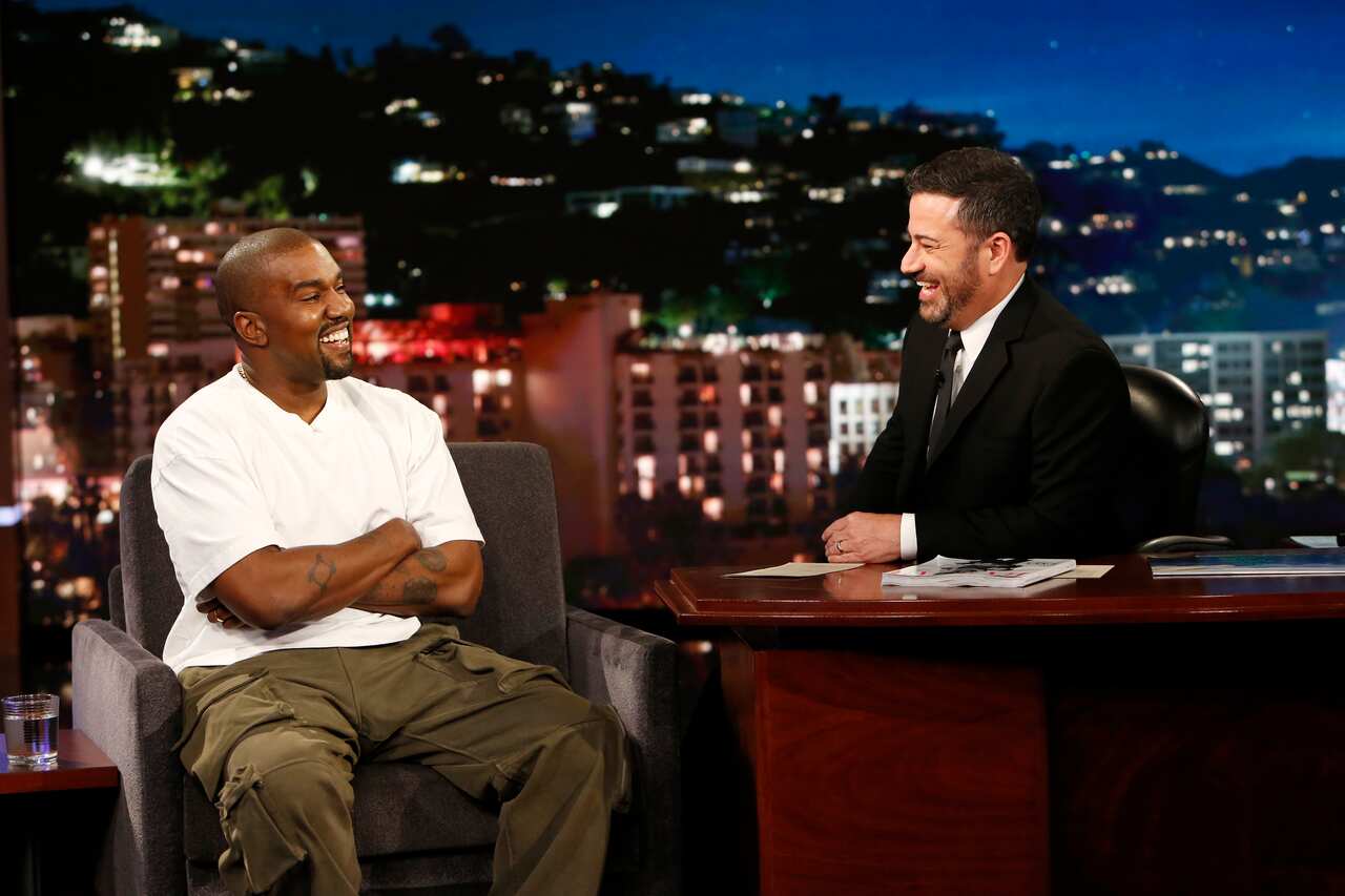 In this image released by ABC, musician Kanye west, left, and host Jimmy Kimmel appear on the set of "Jimmy Kimmel Live!" in Los Angeles.