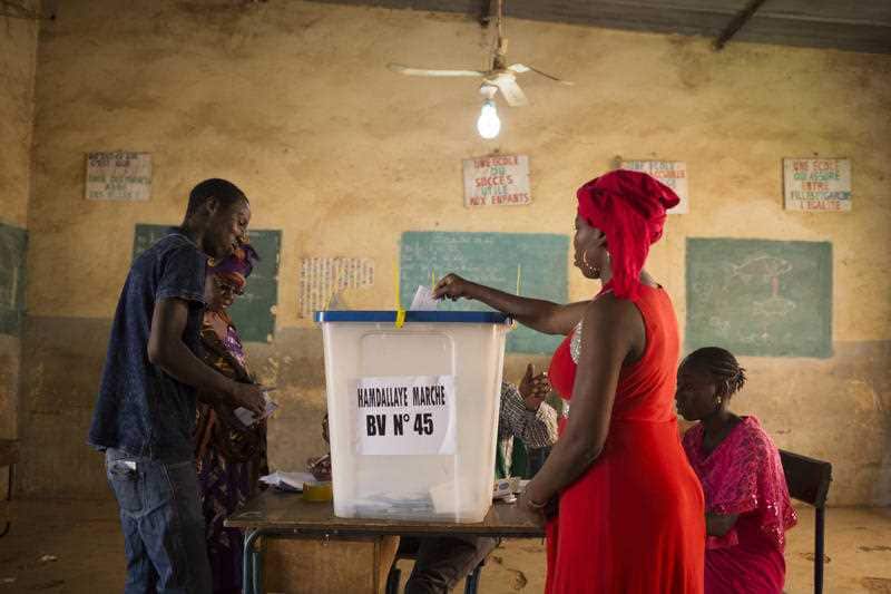 A woman casts her ballot during the Presidential second round election in Bamako, Mali.