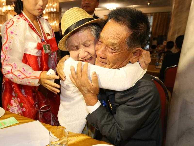 Lee Gyum-sum (L), 92, of South Korea meets with her North Korean son Lee Sung-chul (R), 71, during the inter-Korean family reunions.