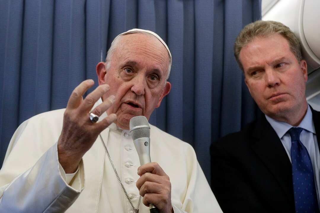 Pope Francis aboard the flight to Rome at the end of his two-day visit to Ireland.