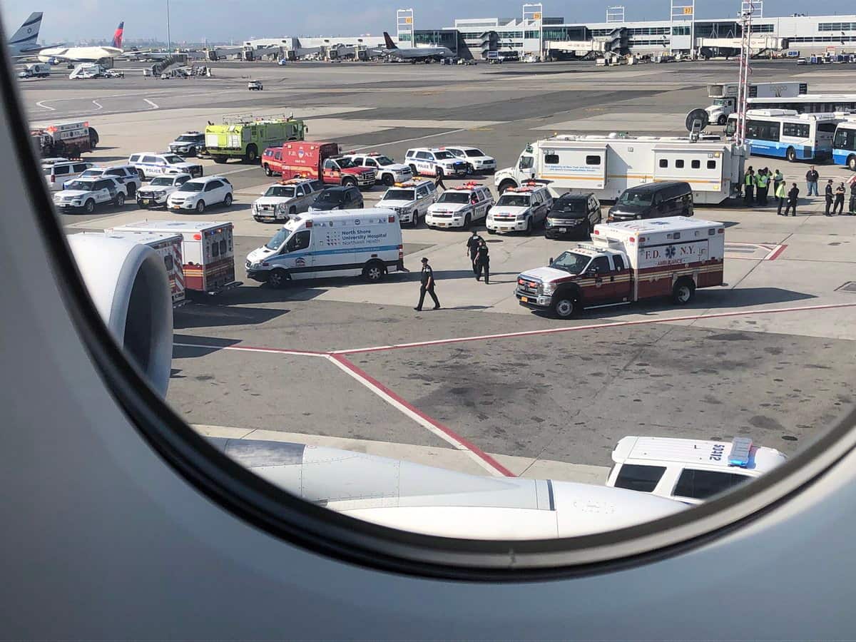 Photo released with permission via Twitter user @LarryCoben shows ambulances approaching Emirates Flight 203 from Dubai at John F. Kennedy Airport, New York