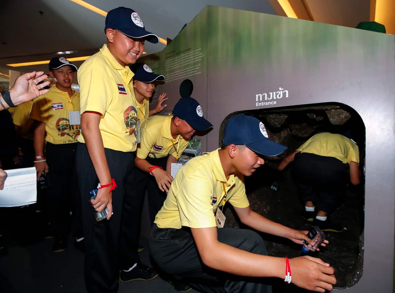 The Wild Boars enter a mock Tham Luang cave.