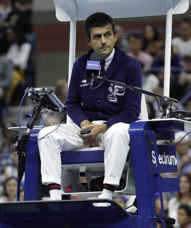 Chair umpire Carlos Ramos watches play as he officiates the match between Serena Williams and Naomi Osaka.