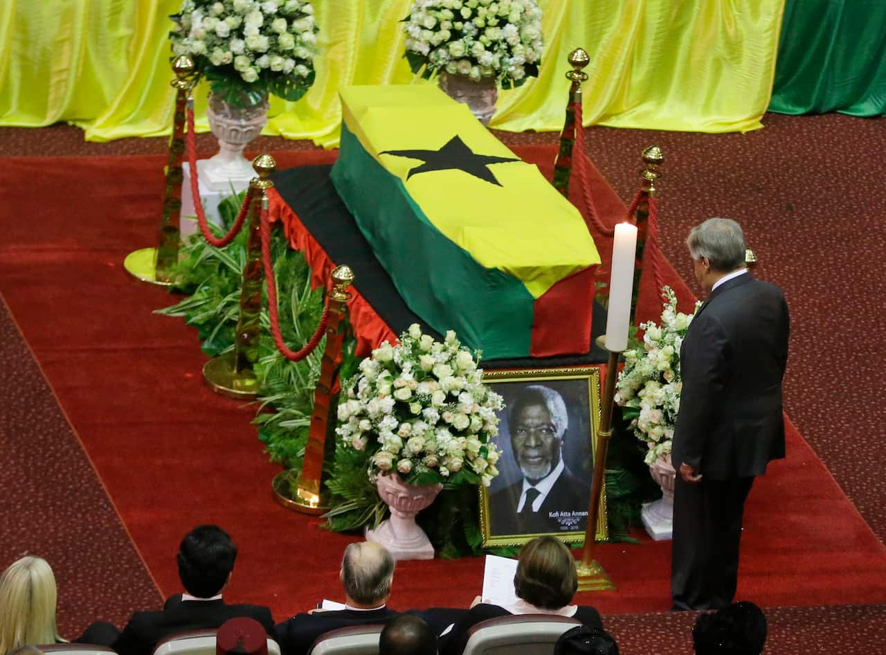 Current UN Secretary-General Antonio Guterres pays his respects by the coffin of former UN Secretary-General Kofi Annan.