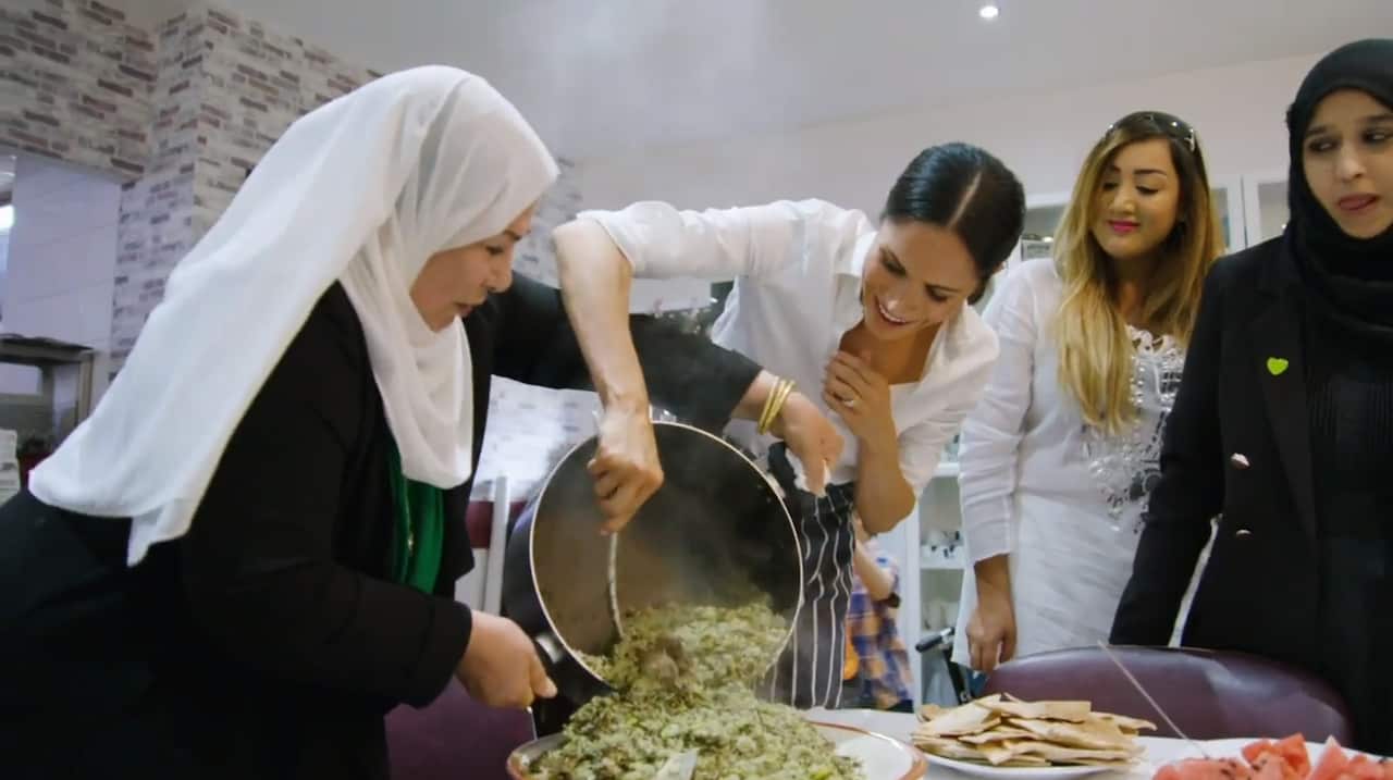 The Duchess of Sussex cooking with women in the Hubb Community Kitchen at the Al Manaar Muslim Cultural Heritage Centre in West London.
