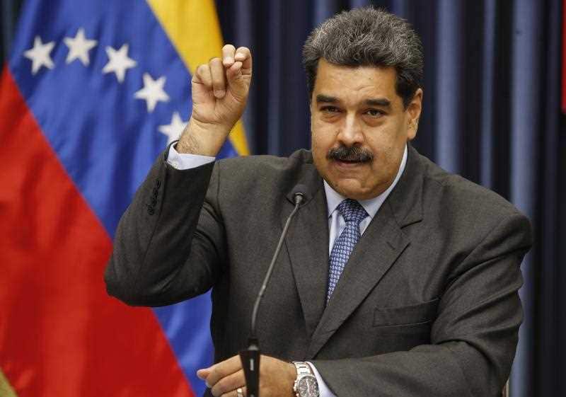 Venezuela's President Nicolas Maduro demonstrates his Salt Bae sprinkling technique during a press conference at the Miraflores Presidential Palace, in Caracas, Venezuela, Tuesday, Sept. 18, 2018.