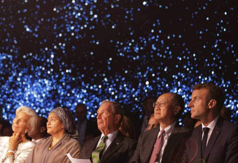 Diplomats watch a video on a wrap-around screen at the start of the One Planet Summit in New York.