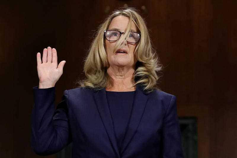 Christine Blasey Ford is sworn in before testifying the Senate Judiciary Committee.