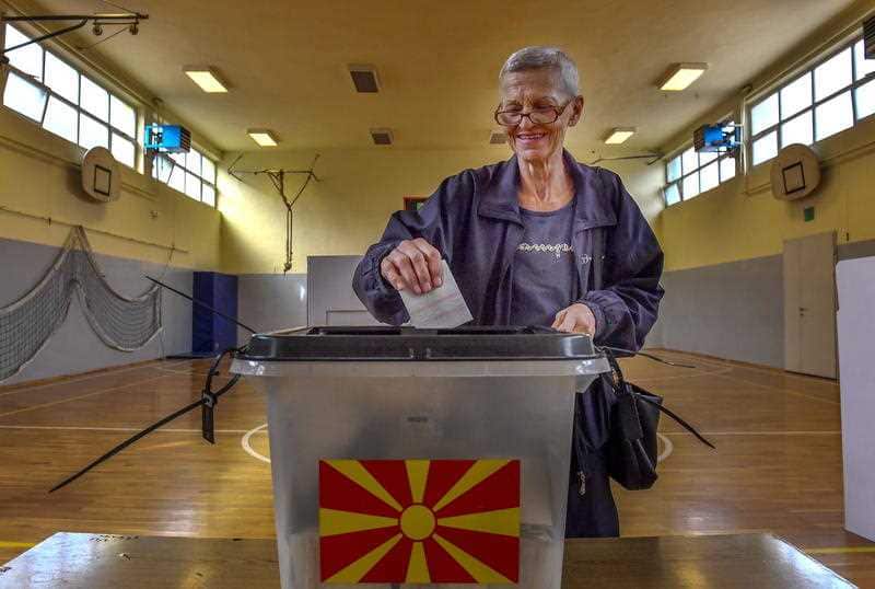 A woman votes in a referendum on the country's name change at a polling station in Skopje, The Former Yugoslav Republic of Macedonia (FYROM), 30 September 2018.