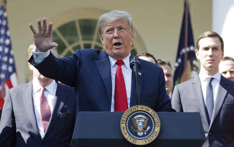 President Donald Trump gestures as he answers questions from members of the media about Supreme Court nominee Judge Brett Kavanaugh in the Rose Garden of the White House in Washington, Monday, Oct. 1, 2018.