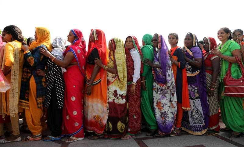 Indian women wait in a queue to pay their respects at the Mahatma Gandhi memorial at Rajghat in New Delhi, India, 02 October 2018.
