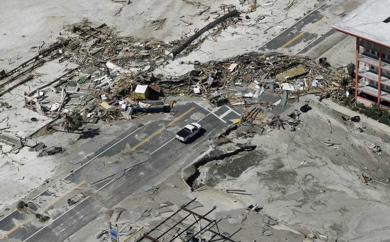 Debris from homes destroyed by Hurricane Michael block a road in Mexico Beach, Florida.