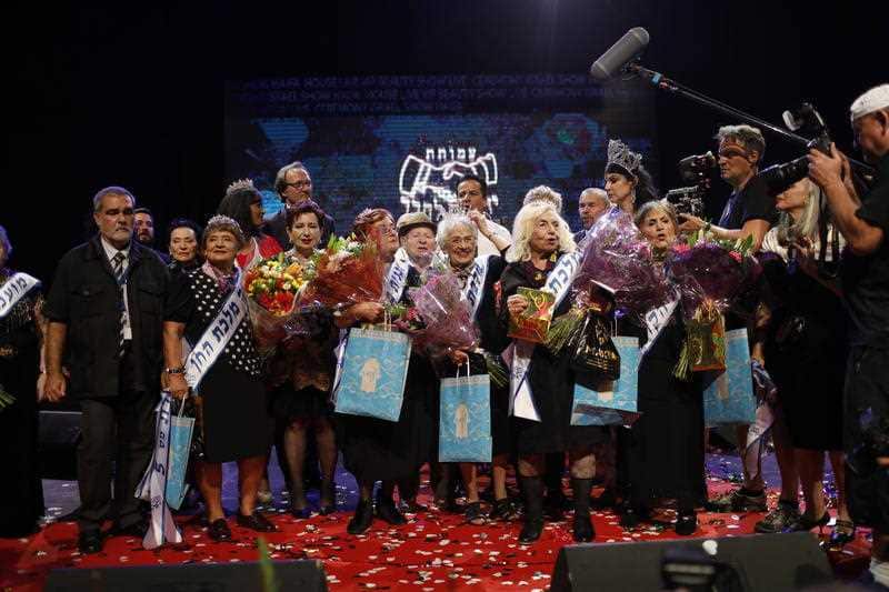 93-year-old holocaust survivor Tova Ringer (C) reacts after winning the 2018 beauty queen contest during the Holocaust Survivor beauty pageant in Haifa, Israel, 14 October 2018.