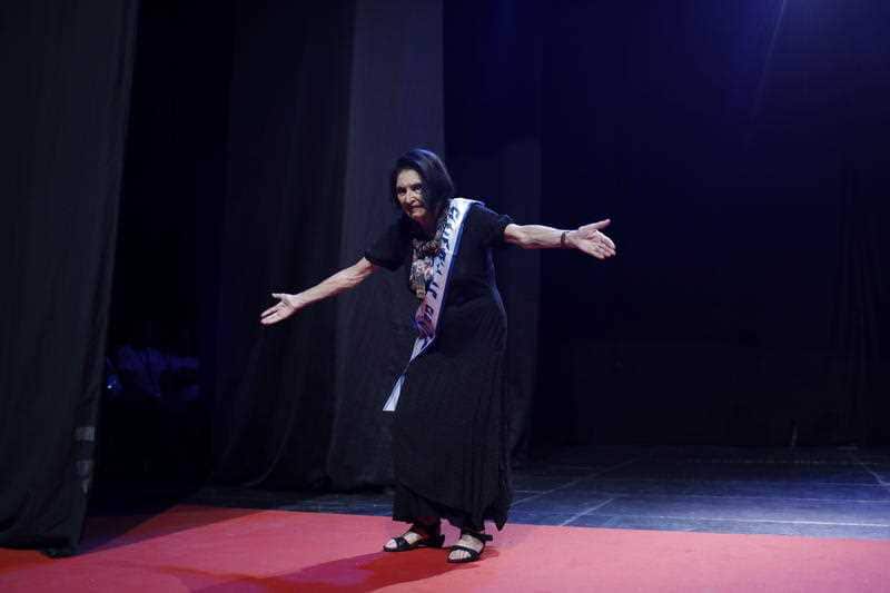 Participant Judith Greenfeld preforms during the 2018 beauty queen contest during the Holocaust Survivor beauty pageant in Haifa, Israel, 14 October 2018.