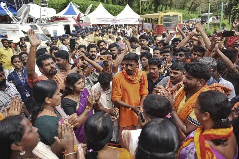 Protestors gather at Nilackal, a base camp on way to the mountain shrine in Kerala, India