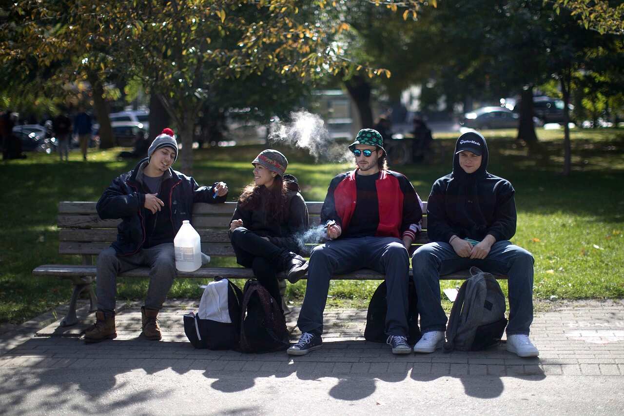 People smoke cannabis in a Toronto park on Wednesday, October 17.